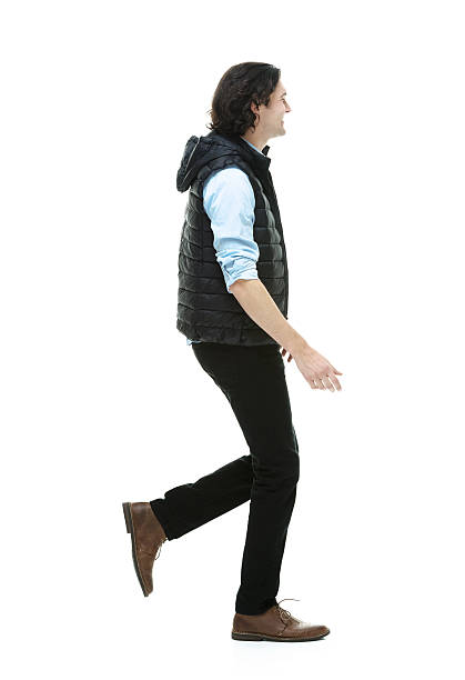 istock Side view of young man walking 463306215