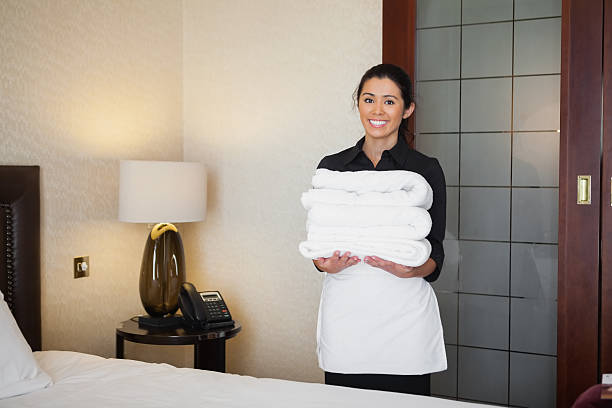 istock Maid holding towels for washing 463313051