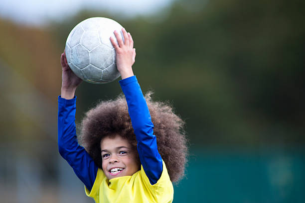 istock Boys Catching A Football 463315989