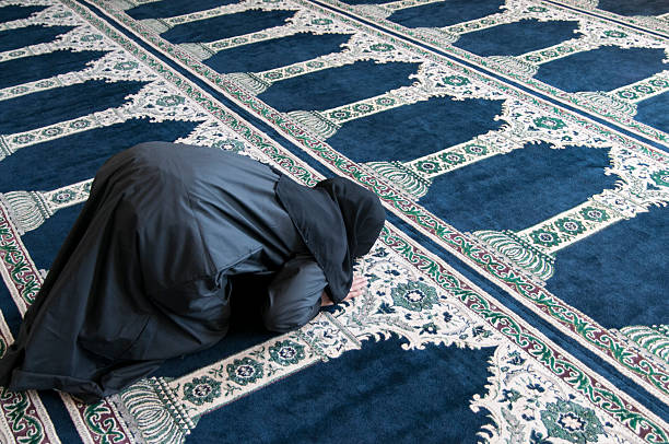 istock Female muslim praying in the mosque 463316023