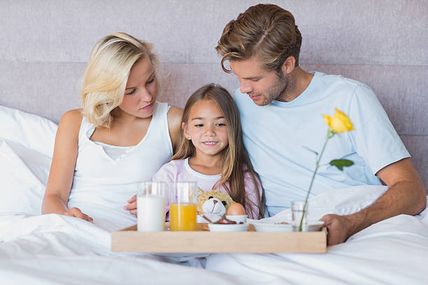 istock Family having breakfast in bed 463316405