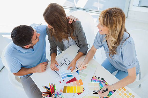 istock Overview of couple with an interior designer 463318547