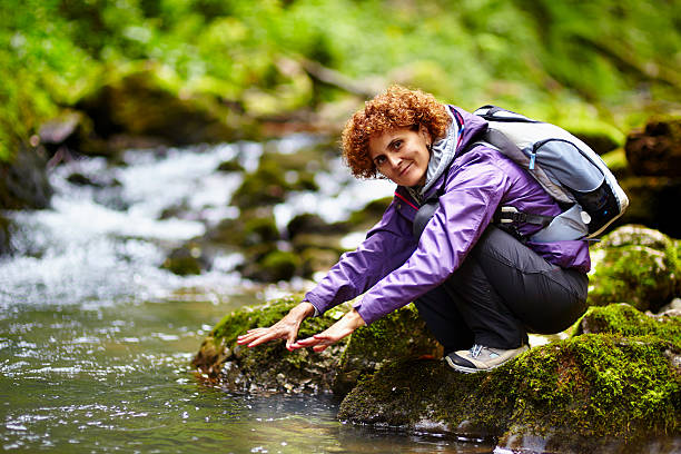 istock Tourist washing hands in a river 463320543
