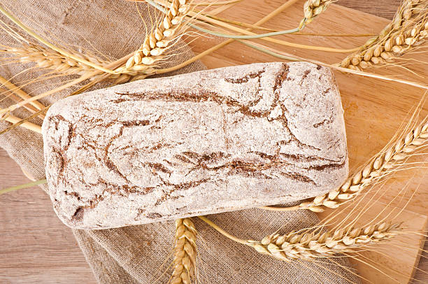 istock Bread rye spikelets on an wooden background 463323701