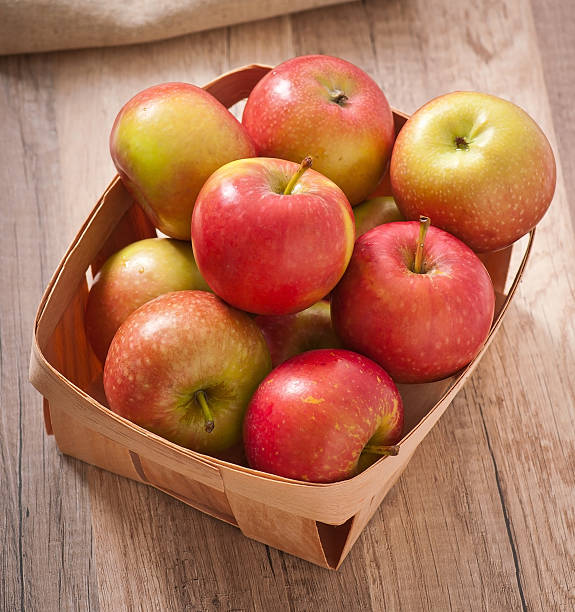 istock Ripe red apples on a wooden backgrounds 463327257