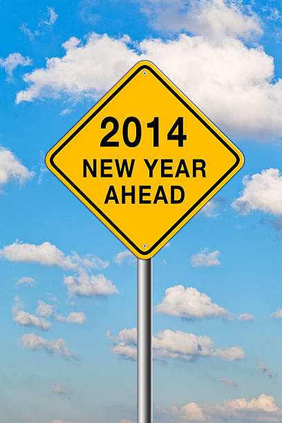 istock New Year 2014 Ahead inside a road sign. 463328469