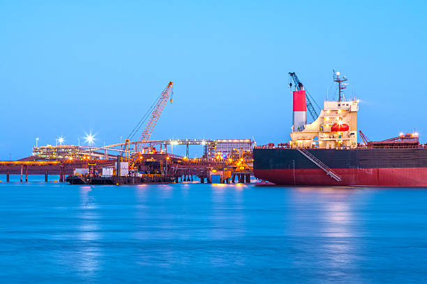 A ship at the docks at sundown stock photo