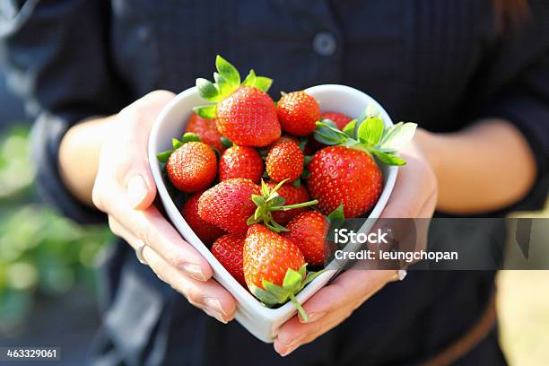 Strawberry In Heart Shape Bowl With Hand Stock Photo - Download Image Now - Abundance, Agriculture, Berry Fruit
