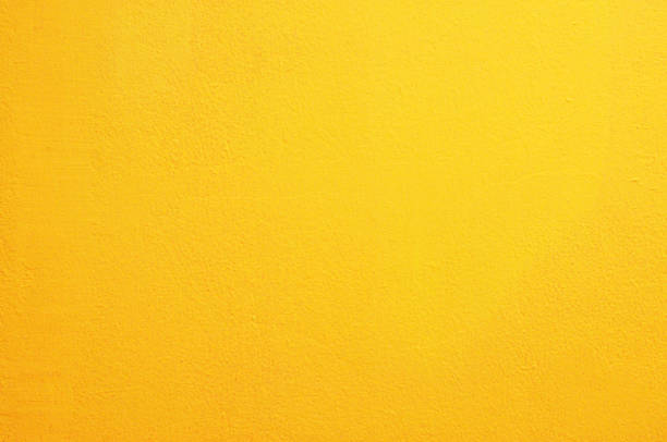 黄色のコンクリートの壁の背景 - 黄色 ストックフォトと画像