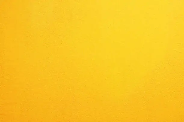 Photo of Yellow concrete wall background