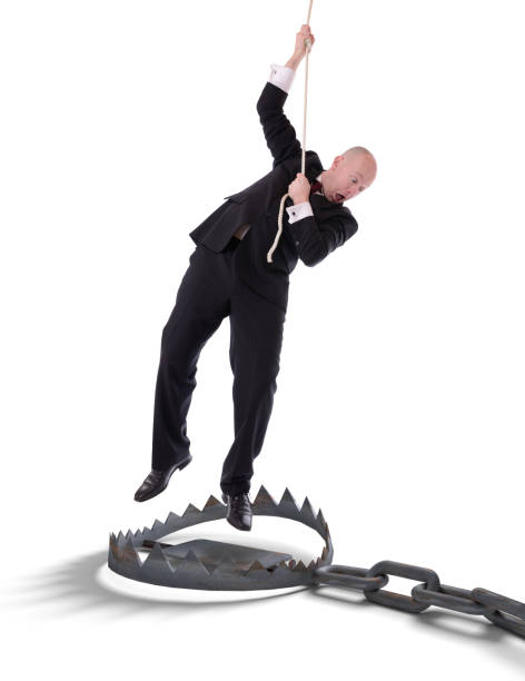 istock businessman hanging on rope 463344231