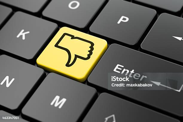 Social Network Concept Thumb Down On Computer Keyboard Background Stock Photo - Download Image Now