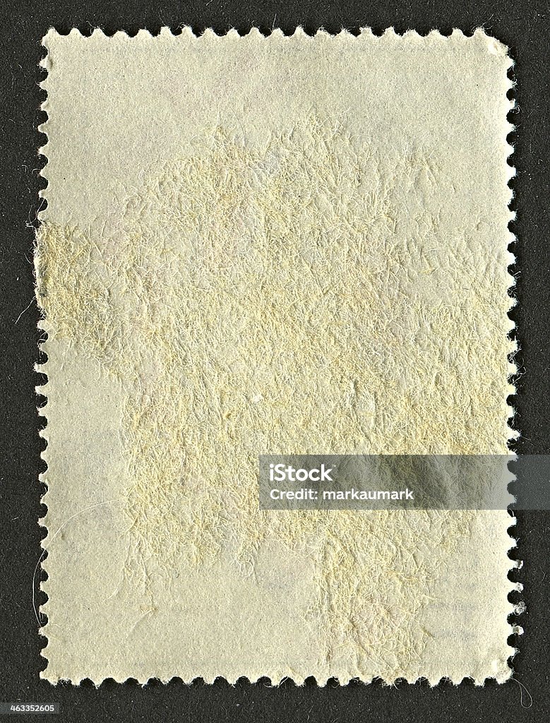 The reverse side of a postage stamp. Backgrounds Stock Photo