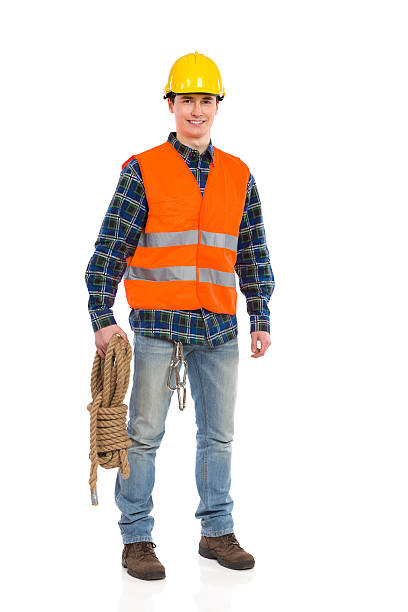 istock Construction worker wearing reflective clothing and holding bundle rope. 463357045