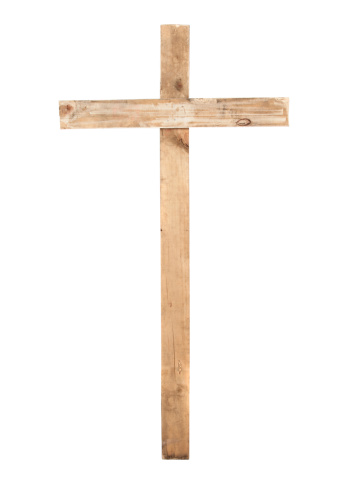 Upright wooden cross isolated on a white background.