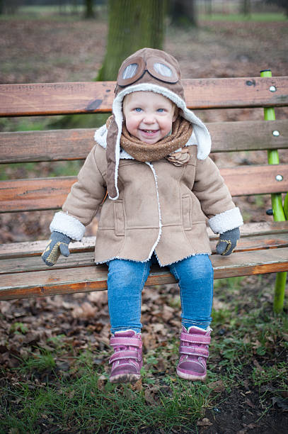 ładny mały pilot - playground snow winter little girls zdjęcia i obrazy z banku zdjęć