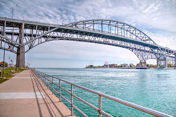 Blue Water Bridge The twin spans of the Blue Water Bridges connect the cities of Port Huron, Michigan and Sarnia, Ontario.  They are the second busiest crossing between the US and Canada. department of homeland security stock pictures, royalty-free photos & images