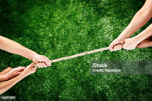 Stalemate Tug Of War With No Clear Winner Stock Photo - Download Image Now - Tug-of-war, Arguing, Beat The Clock