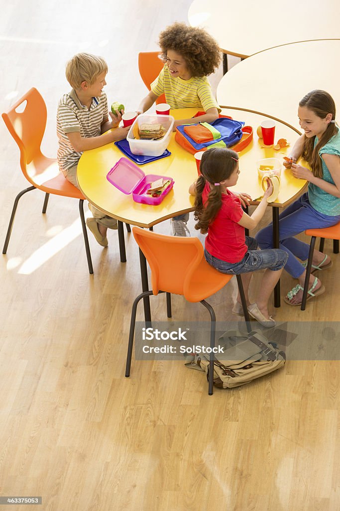 School Dinners Group of children having packed lunches Child Stock Photo