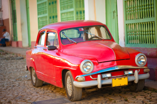 Car on one of narrow streets of Trinidad, Cuba