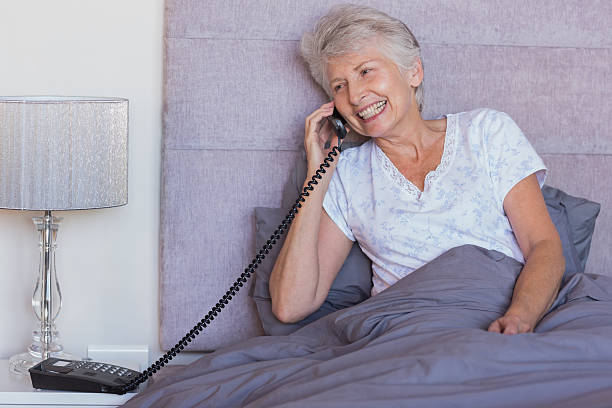 istock Mature woman calling in her bed 463375923