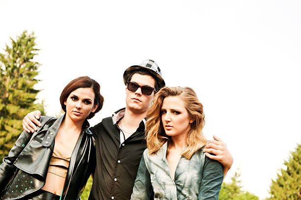 istock Young man with two woman 463376215