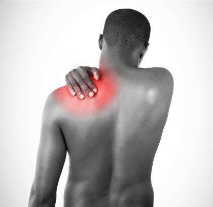 Man rubbing shoulder pain which is highlighted in red