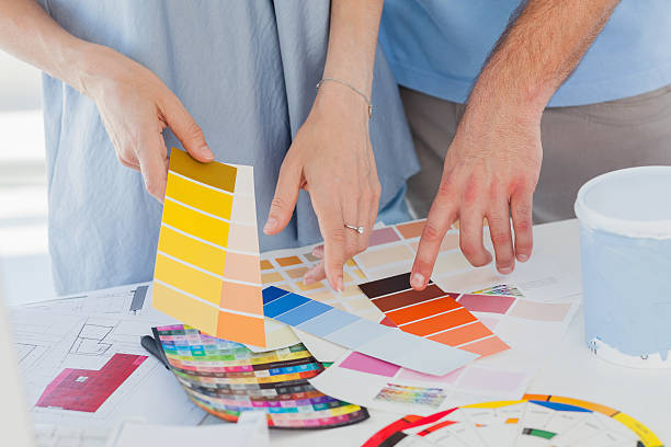 istock Interior designers pointing at colour charts 463377533