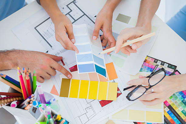 istock Hands of Interior designers working on colour charts 463377535