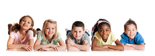 istock kids laying on stomach with hands putting in the front 463379343