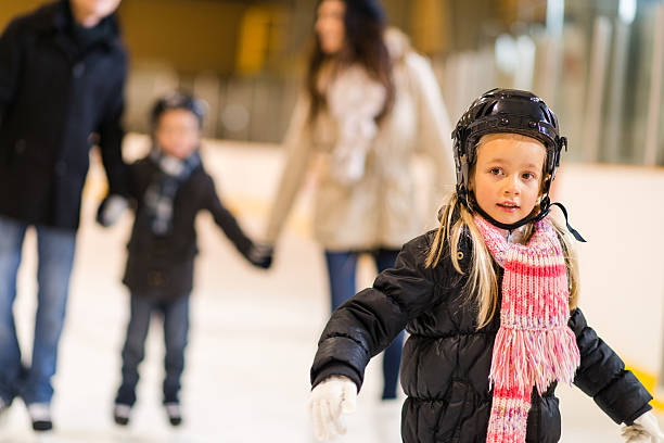 istock People having fun on skating rink 463383837