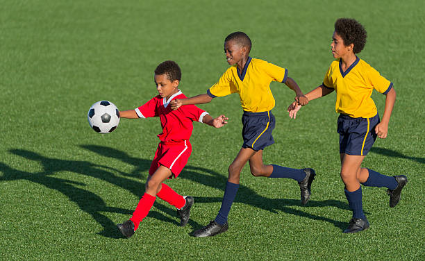 istock Young Boys Playing Football 463384103