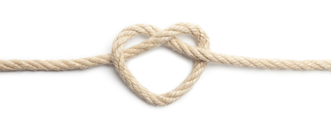 Close up of rope heart on white background. This file is cleaned, retouched and contains 