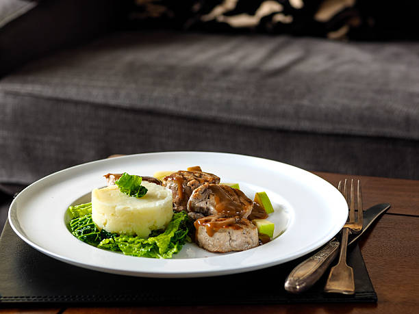 istock Grilled pork tenderloin with fresh herbs and shaped potatoes 463384737
