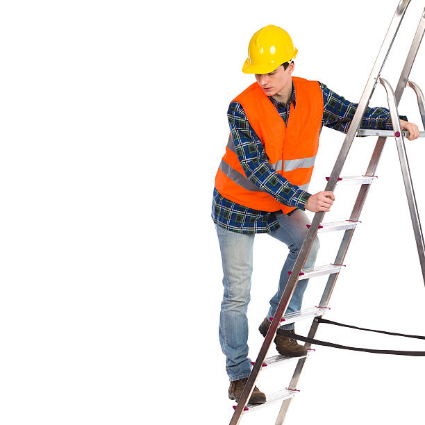 istock Construction worker in reflective clothing climbing a ladder. 463386105