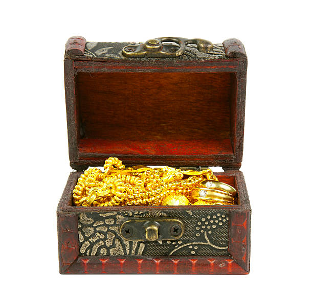 istock gold in ancient treasure chest 463392393
