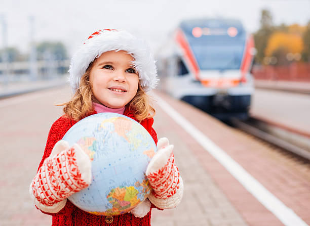 istock Little girl Santa travelling with a globe 463393367