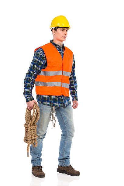 istock Construction worker wearing reflective clothing and holding bundle rope. 463393793