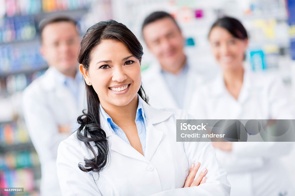 Group of doctors Group of doctors at the pharmacy looking happy Pharmacist Stock Photo