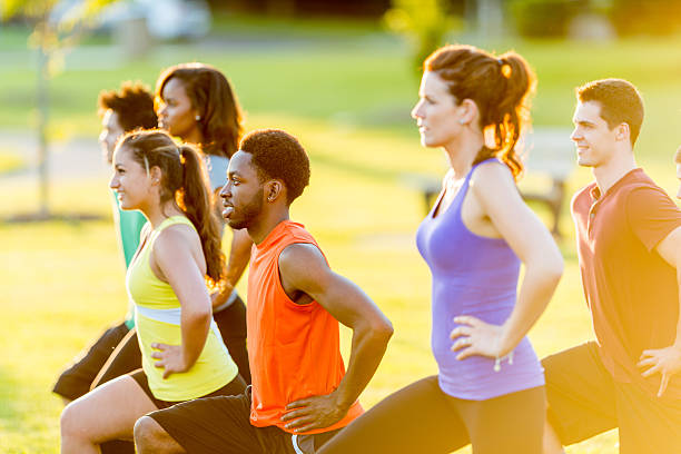 istock Men and women exercising outdoors 463399535