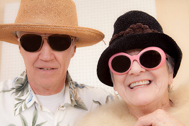 istock Active Seniors: Silly senior couple gets ready for vacation. 463402359