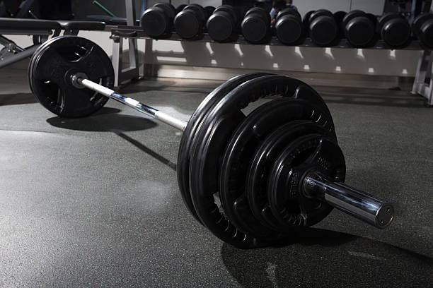 istock metal barbell on dark gray background 463402465