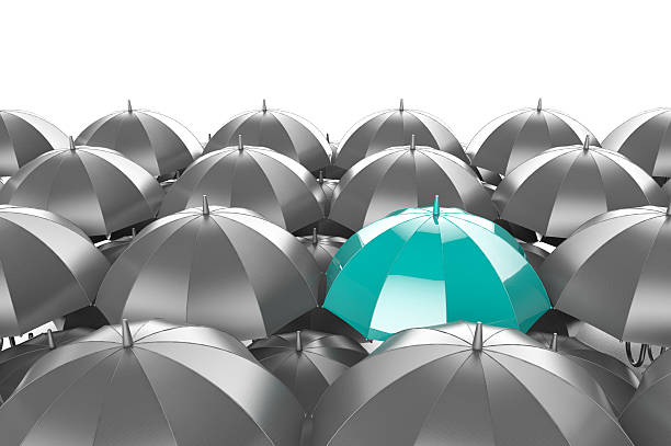istock Illustration of one blue umbrella among many dark 463403381
