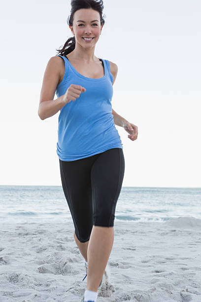 istock Attractive woman jogging towards camera 463406103