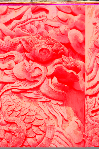 Ancient stone dragon. Scanned from velvia slide film, this dragon is part of a stone column relief on the outside of a Caodi temple in South Vietnam.
