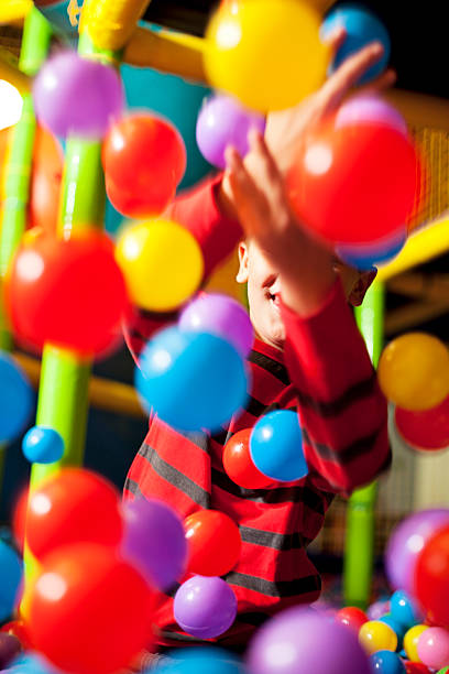 istock Little boy in the ball pool 463407185