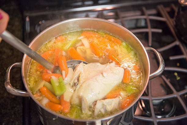 caseira sopa de frango em uma panela - soup carrot celery chicken - fotografias e filmes do acervo