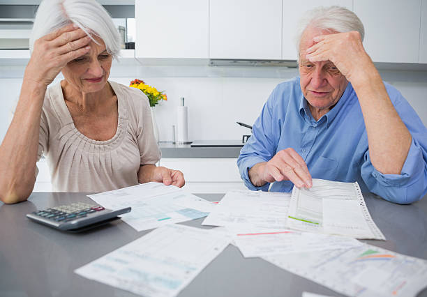 istock Concentrated mature couple doing their accounts 463408035