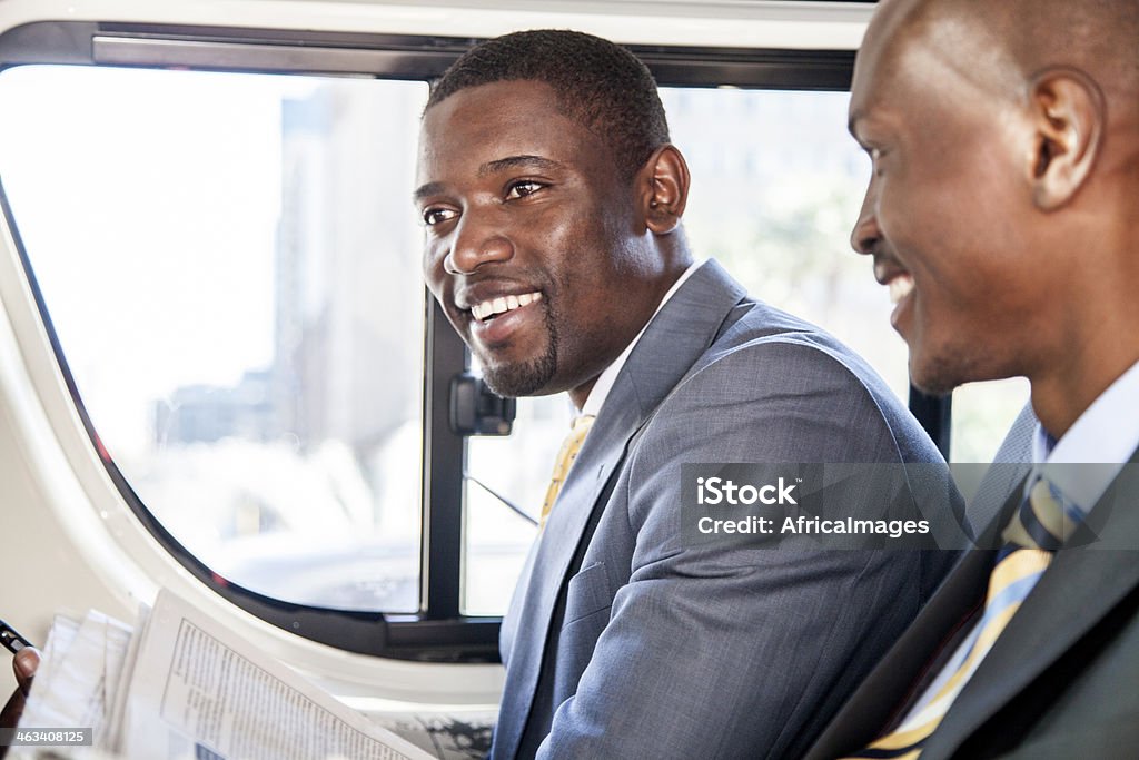 African businessmen talking in a taxi African businessmen talking in a taxi in Cape Town, South Africa. 20-29 Years Stock Photo