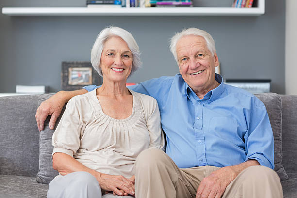 istock Romantic mature couple together on their sofa 463408129